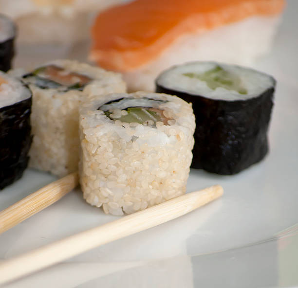 istock Different japanase sushi rolls with chopstic 486724736