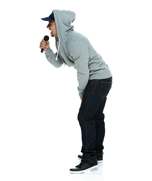 istock Side view of male rapper with microphone 486725831