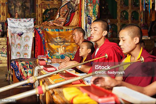Tibetan Monks Praying During Puja Stock Photo - Download Image Now - Tibet, Monk - Religious Occupation, Buddhism