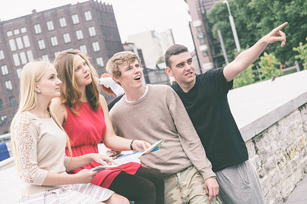 istock Group of Friends Looking at Map 486726847