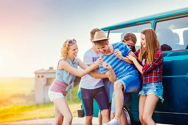 istock Young hipster friends on road trip 486728860