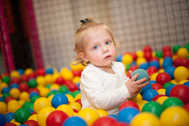 istock Baby girl in ball pool 486729251