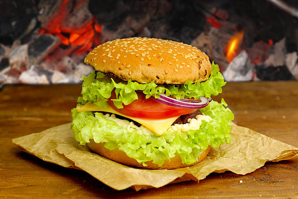 istock burger with grilled beef, cheese and vegetables 486729883