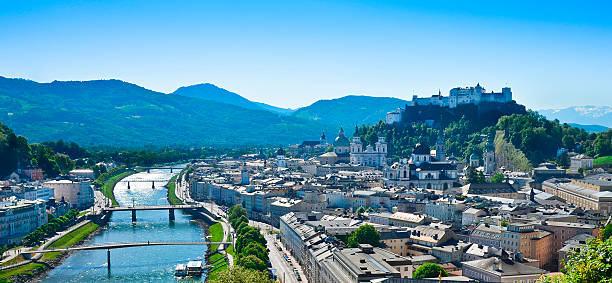 Salzburg City Panorama Panorama of the city of Salzburg in Austria, Europe, the festival city where Wolfgang Amadeus Mozart was born. View of the castle, Moenchsberg, old town and the Salzach river. Kapuzinerberg stock pictures, royalty-free photos & images