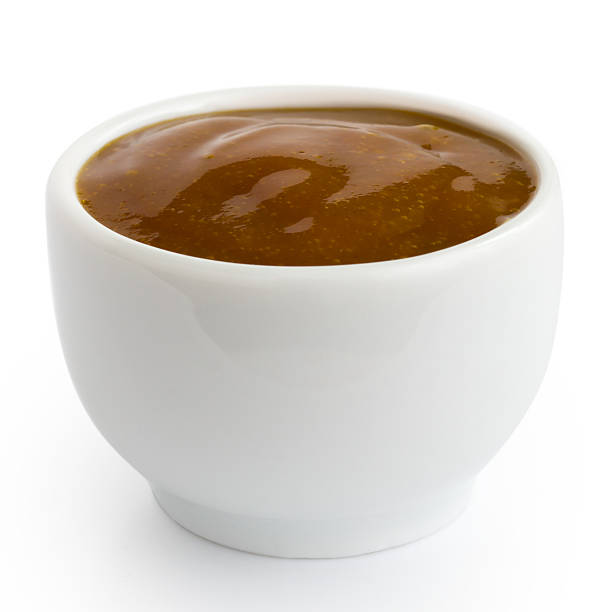 istock Small white pot of curry sauce dip. 486732798