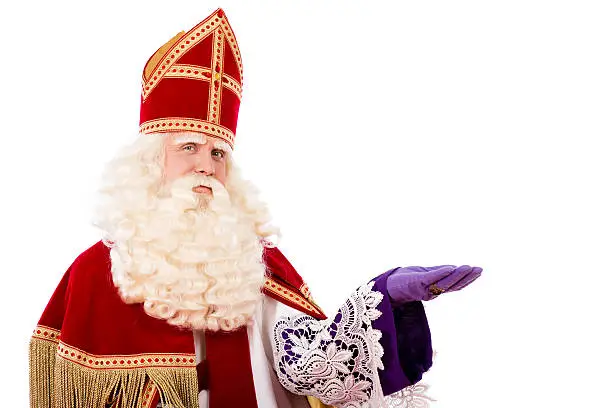 Sinterklaas portrait. isolated on white background. Dutch character of Santa Claus or St. Nicholas and Black Pete