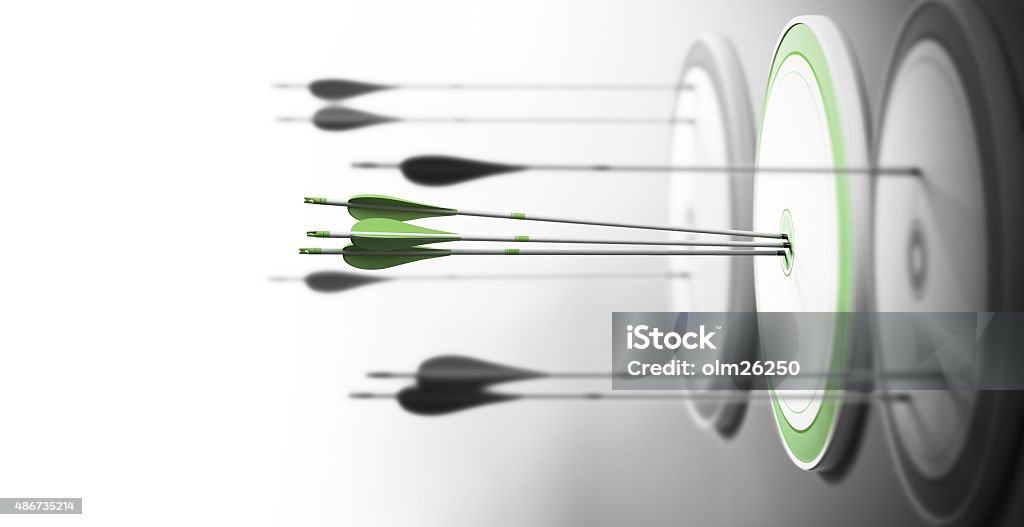 Excellence Three targets with focus on the one in the center and arrows hitting the center. Concept of competitive excellence and performance. Business Stock Photo