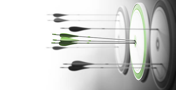 Excellence Three targets with focus on the one in the center and arrows hitting the center. Concept of competitive excellence and performance. bow and arrow photos stock pictures, royalty-free photos & images