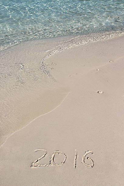 istock Handwriting inscription 2016 on the beach 486735392