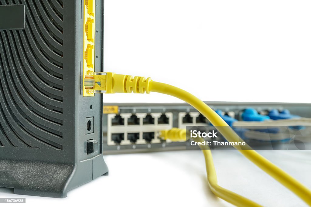 Network cable connect to router Network cable connect to router and switch hub on white background 2015 Stock Photo