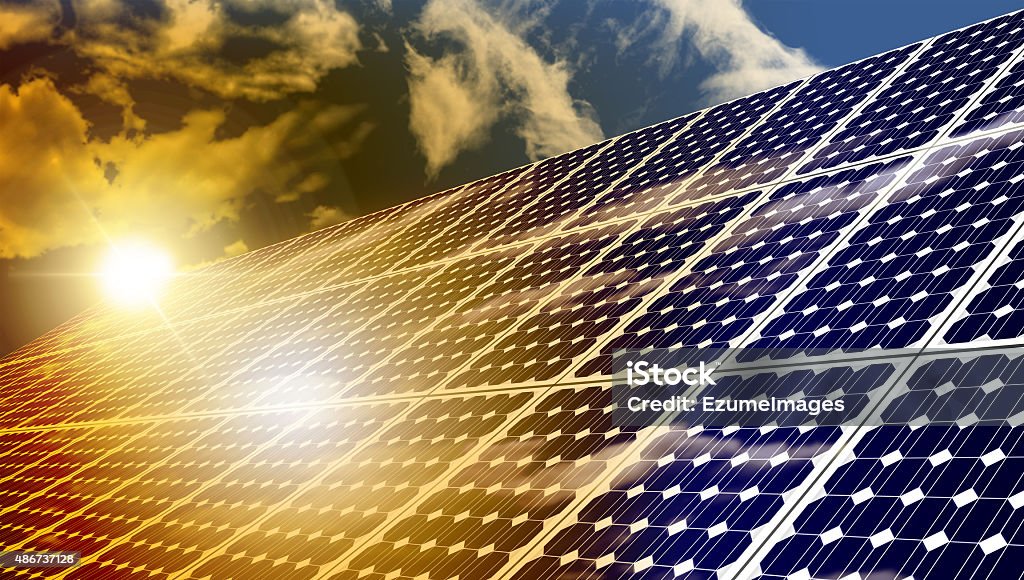 Solar Panels Solar panels absorbing the suns energy on hot summer day 2015 Stock Photo