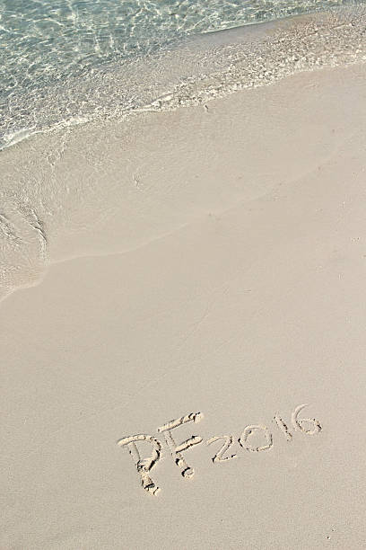 istock Handwriting inscription PF 2016 on the beach 486738066