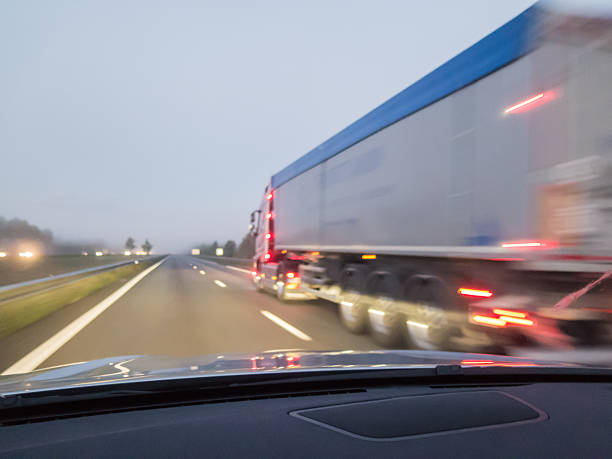 istock Overtaking a truck in early morning mist and low light. 486739248