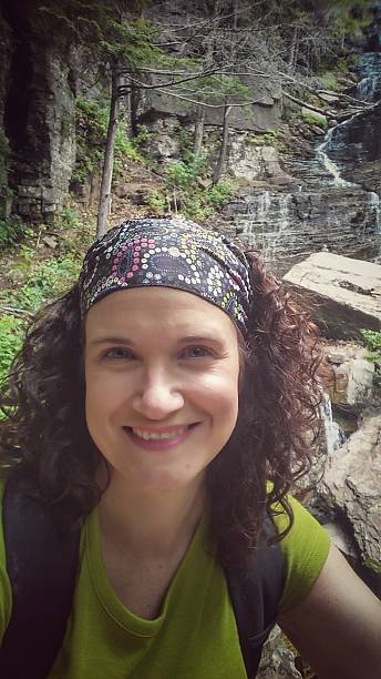 istock Female Hiker Wearing Backpack, Lye Brook Falls, Vermont 486740076