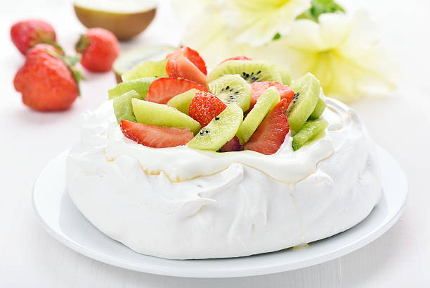 istock Pavlova cake with kiwi and strawberry 486740402