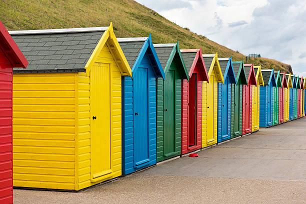 istock Wooden beach huts at Whitby, England 486743452