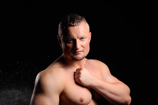 istock Muscular male posing on black background 486743675