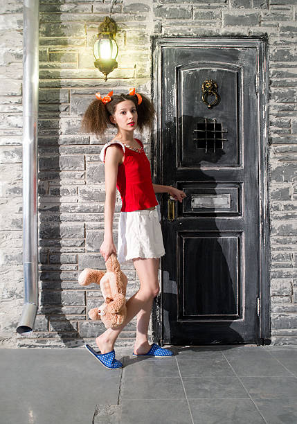 istock Girl at the door 486744125