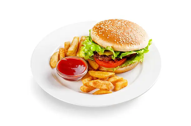 Photo of hamburger with fries and sauce on a white background