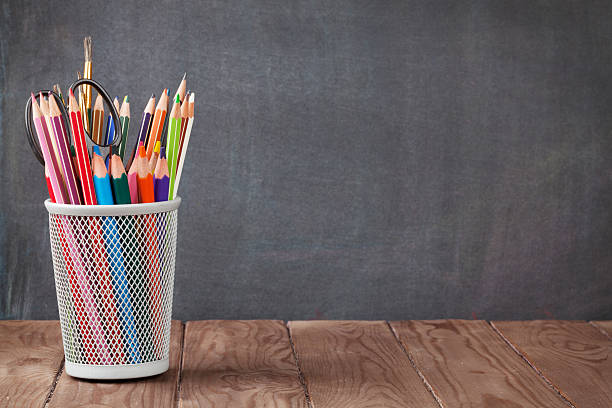 istock School and office supplies on classroom table 486746438