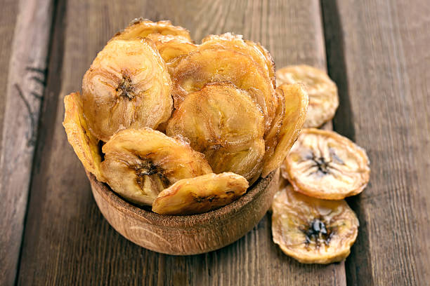 istock Homemade banana chips in bowl 486746864