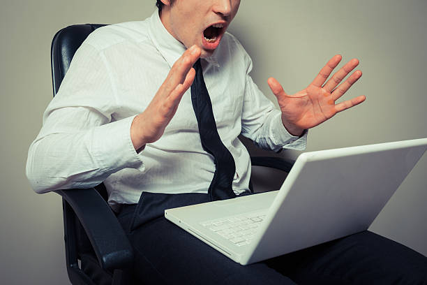 istock Nervous businessman wih laptop 486747037