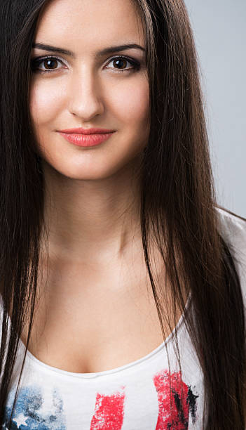 istock young brunette girl smiling 486747075