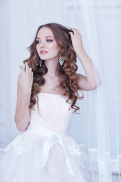 istock beautiful bride, long curly hair 486747081