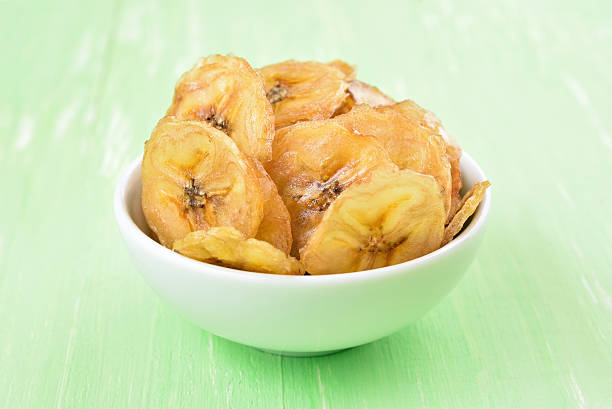 istock Banana chips in white bowl 486747158