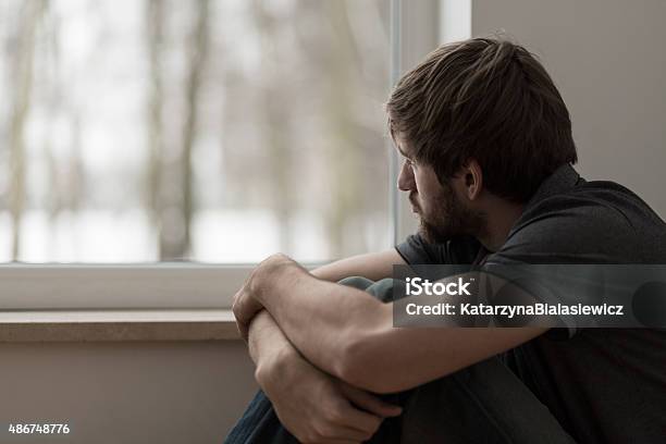 Young Man Suffering For Depression Stock Photo - Download Image Now - Men, Depression - Sadness, Sadness