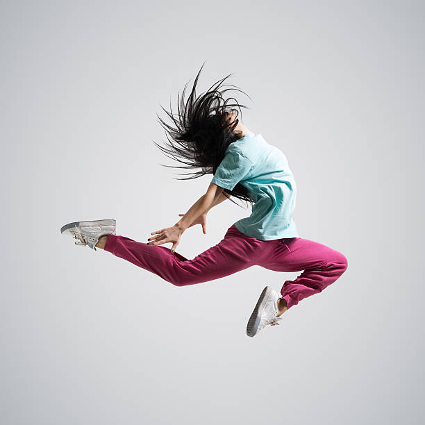 istock athletic girl dancing jumping 486748919