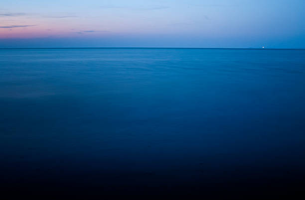 istock Blue hour sky and horizon over water after sunset 486749066