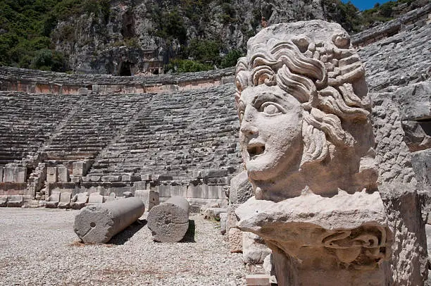 Stone mask and ancient amphitheater, Myra (Turkey)