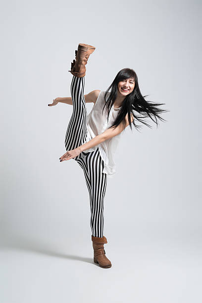 istock girl in boots throws leg smiling 486749661