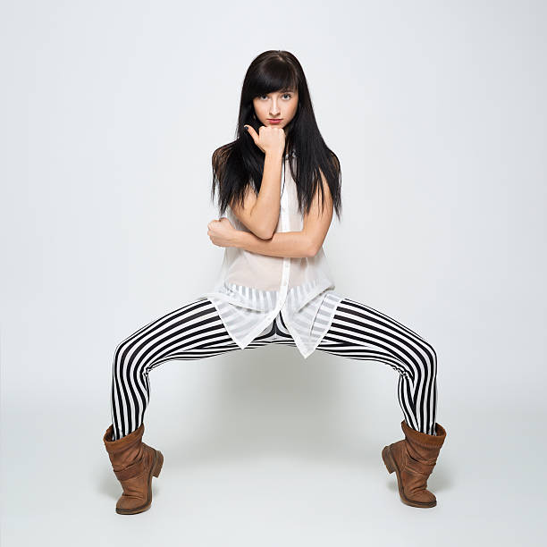 istock girl in boots as if sitting on a chair 486749663