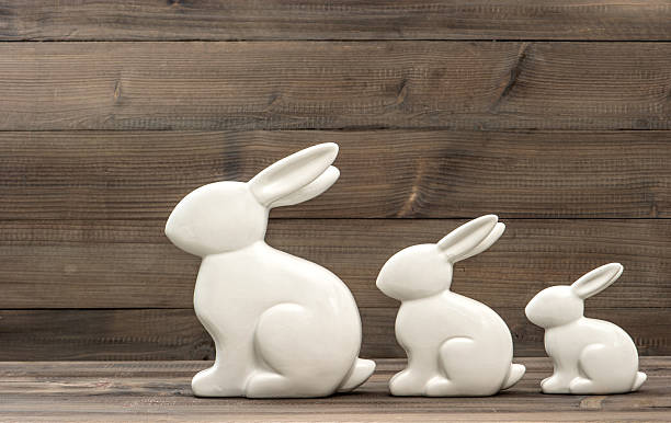 istock cute easter bunny family on wooden background 486750815