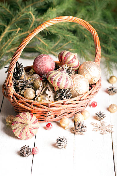 istock Christmas basket with red and golden ornaments 486751456