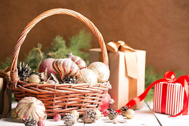 istock Christmas basket with red and golden ornaments 486751732