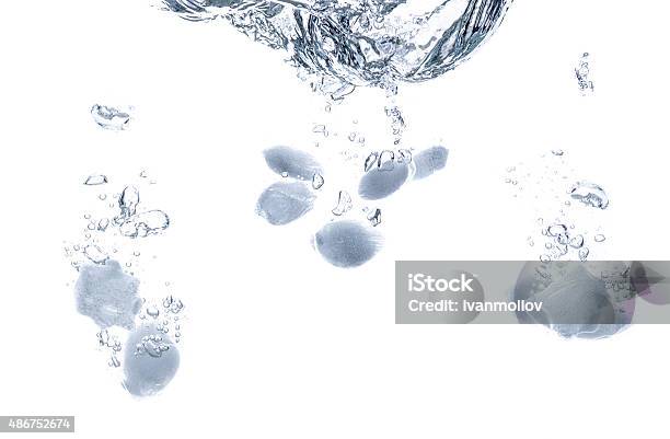 Ice Cubes Splash Close Up Stock Photo - Download Image Now - 2015, Blue, Bubble