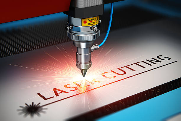 Laser cutting technology Laser cutting metal industry concept: macro view of industrial digital CNC - computer numerical control CO2 invisible laser beam cutter machine cutting stainless steel sheet with lot of bright shiny sparkles. See also: laser cutting metal stock pictures, royalty-free photos & images