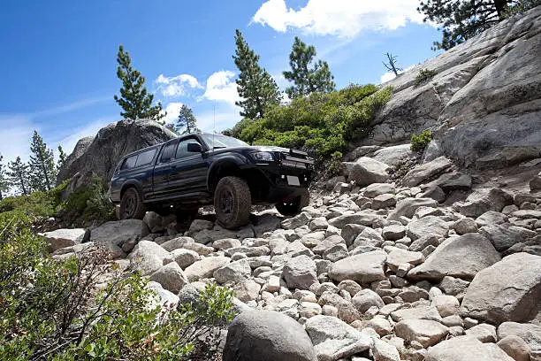 A customized Toyota Tacoma first generation truck on Slick Rock trail at Lake Alpine.