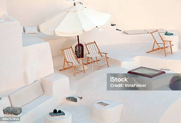 White Terrace With Deck Chairs In Caldera House Santorini Greece Stock Photo - Download Image Now