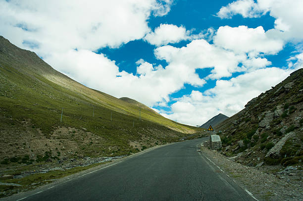 istock road in mountainous area 486760544