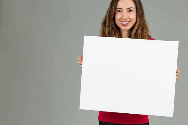 istock Woman showing blank marketing billboard 486761348