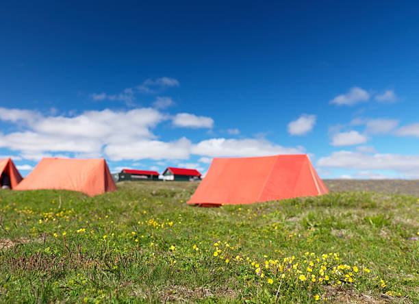out of focus view of camping tents stock photo