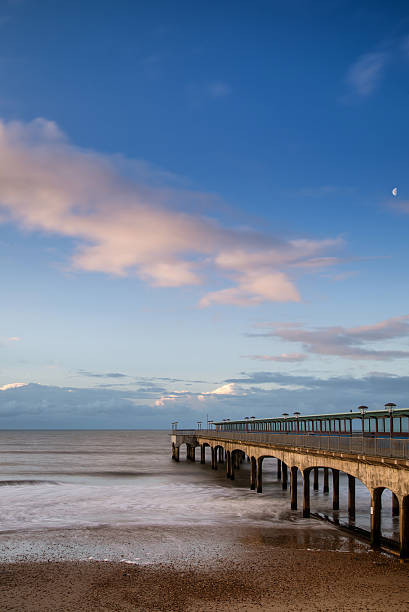 istock Dawn landscape of pier stretching out into sea 486763549