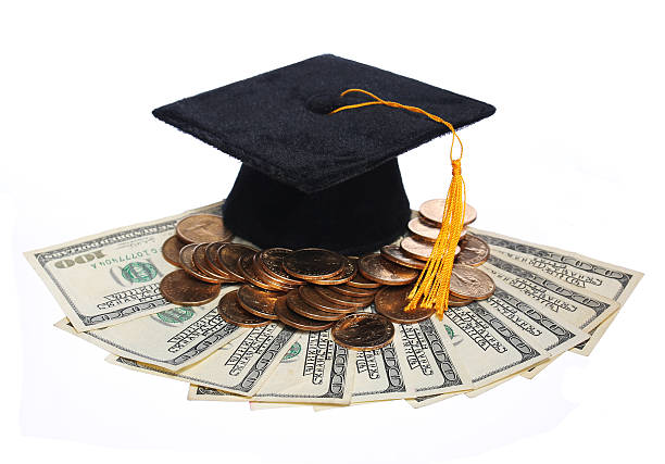 istock Black Graduation Cap and Money isolated. 486765111