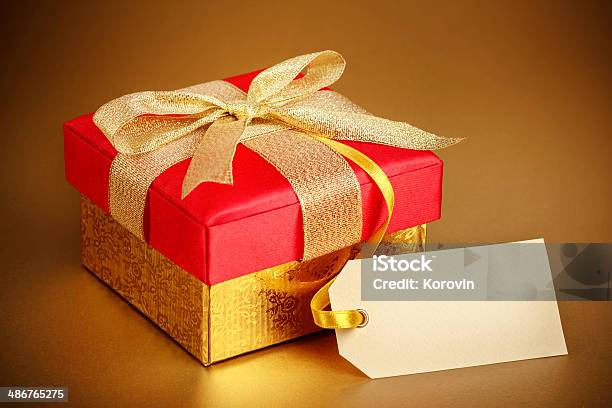 Christmas Gift Box On Gold Background Stock Photo - Download Image Now - Anniversary, Backgrounds, Birthday