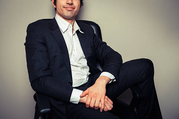 istock Happy young businessman in relaxed pose 486765375
