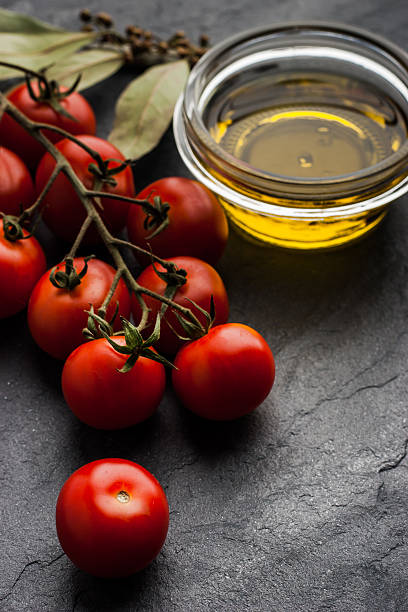 istock Tomatoes twig with bay leaf and olive oil 486765526